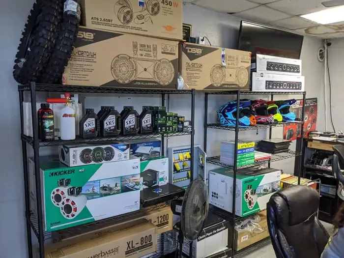Oil, tires, audio gear and riding gear stocked on the shelves at TMT Offroad in Williston, FL